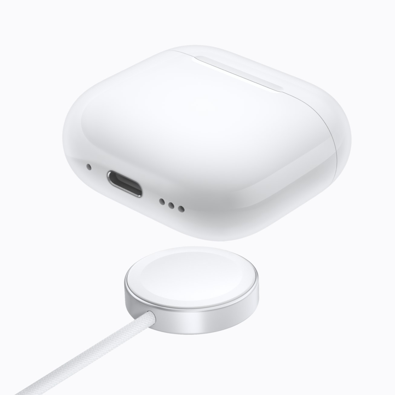 AirPods 5のワイヤレス充電ケースと、軸部分を上下にスワイプして音量を調節する操作の説明画像