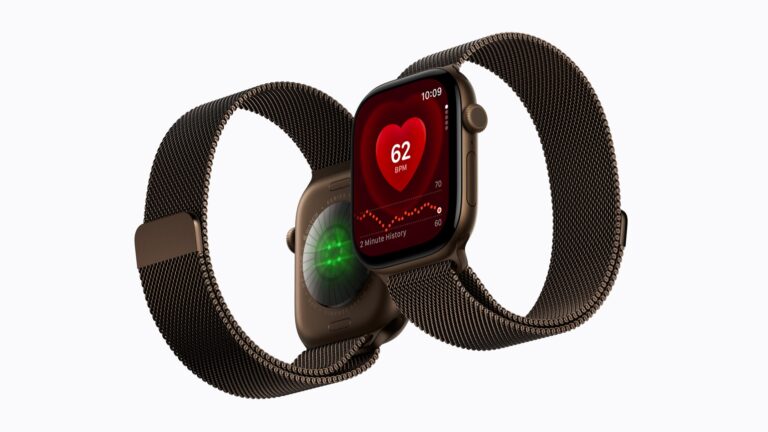 ダークブロンズのミラネーゼループを組み合わせたApple Watch Series 12が2台。手前は背面の光学式心拍センサーが緑に光り、奥は心拍数アプリで62 BPMと2分間の履歴を表示している