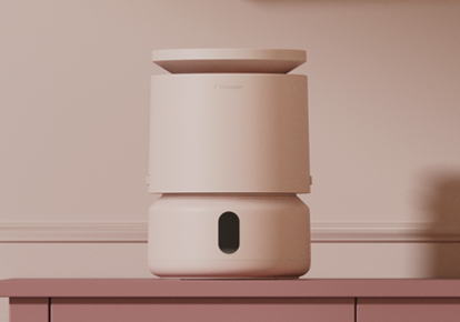 ピンクの壁の前に置いた30周年限定カラーの加湿器DreamWell Mini Humidifier H21 Aurora Blush